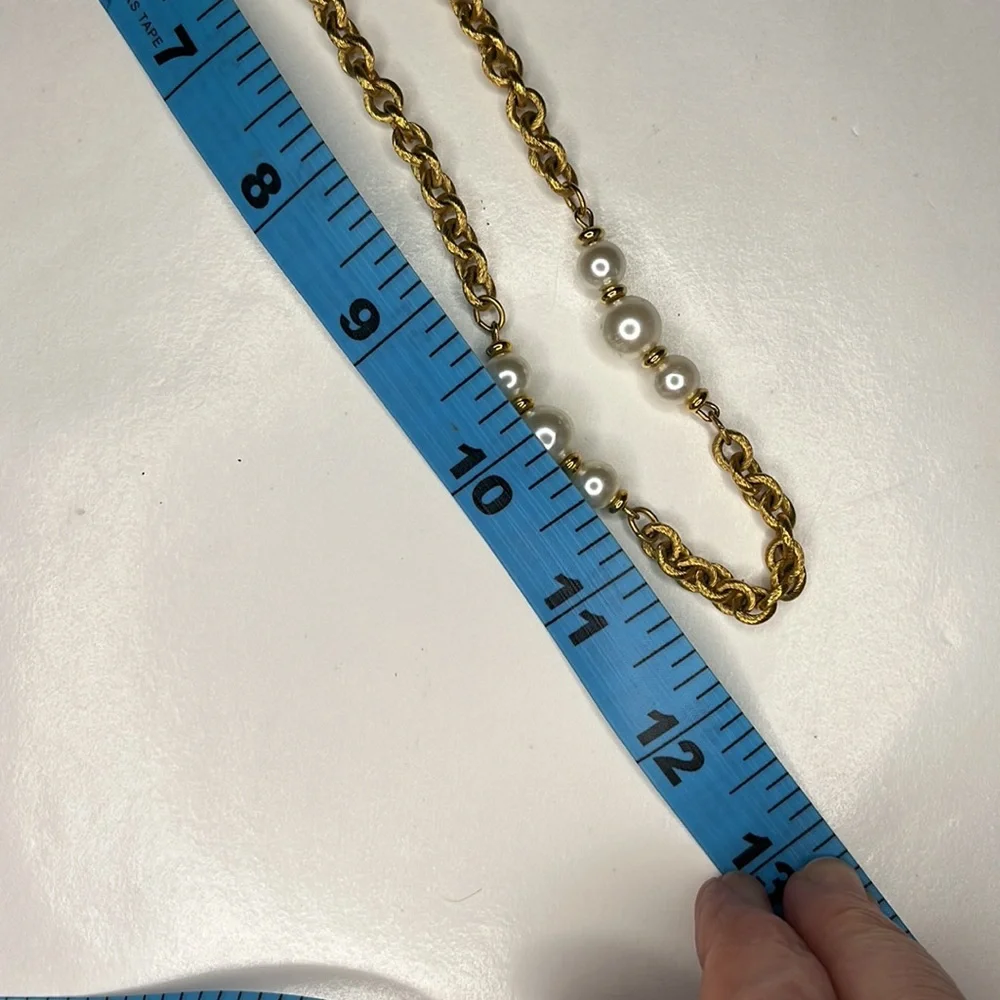 Napier single strand gold tone chain with faux pearls.